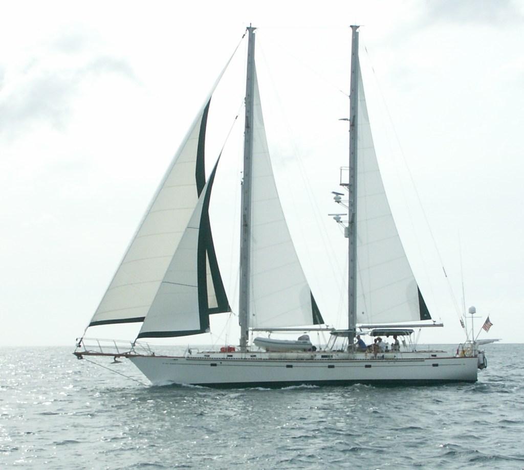 Cruising sailboat at anchor with new standing rigging