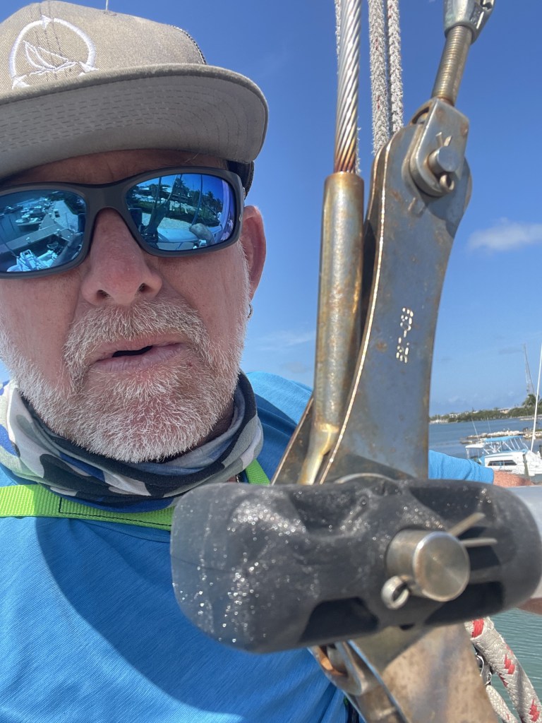 Close-up of running rigging and deck hardware under sail
