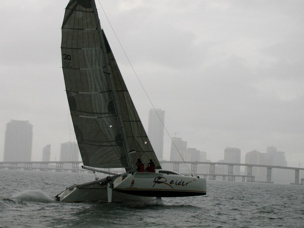 Performance racer under sail displaying tuned high-load rigging